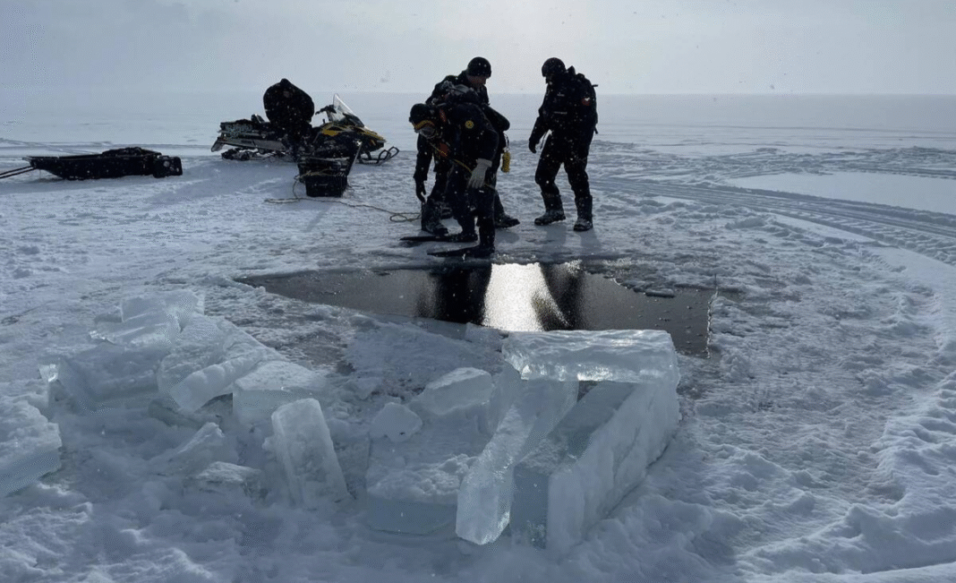 Two snowmobilers found dead beneath ice on northwestern B.C. lake