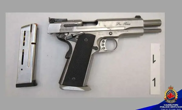 Man arrested following Hamilton dealership break-in, police seize loaded handgun 