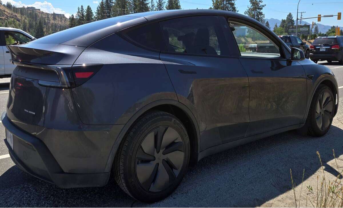 West Kelowna tesla driver ticketed after reading documents while driving on Highway 97 
